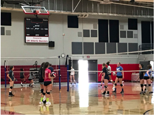 The girls volleyball teams work on hitting and bumping during a recent practice.