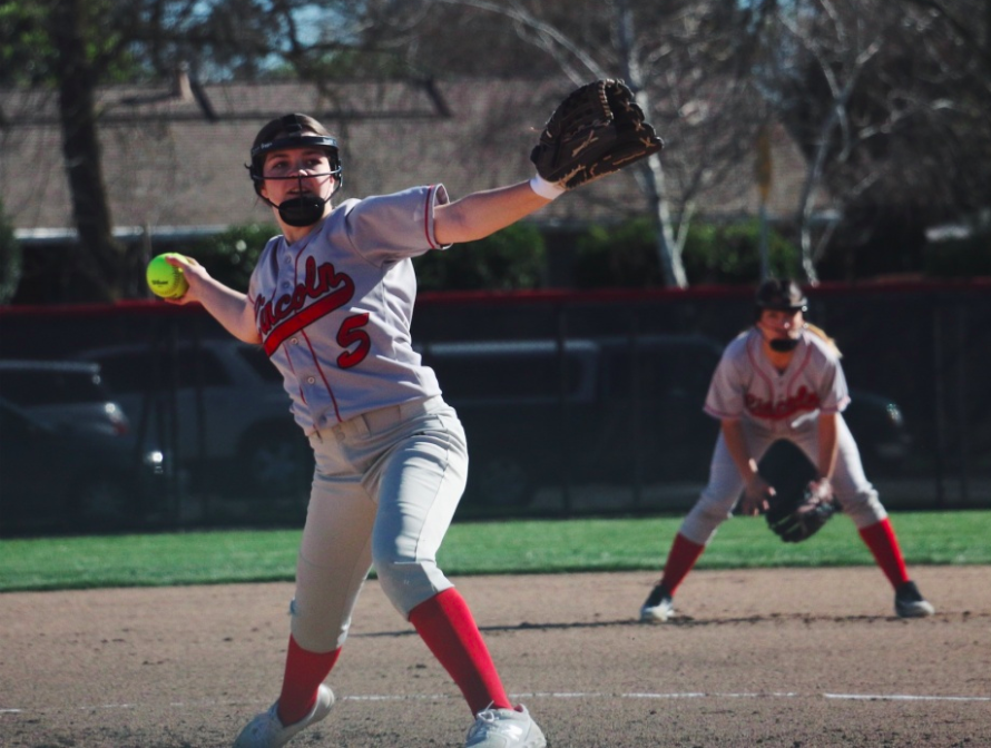 Olivia Riggio tosses a pitch during the Trojans March 11 match against Lodi.