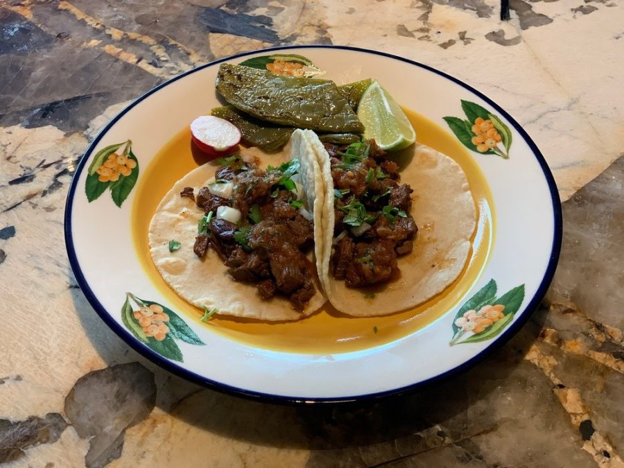 Slow cooked carnitas tacos served with homemade tortillas