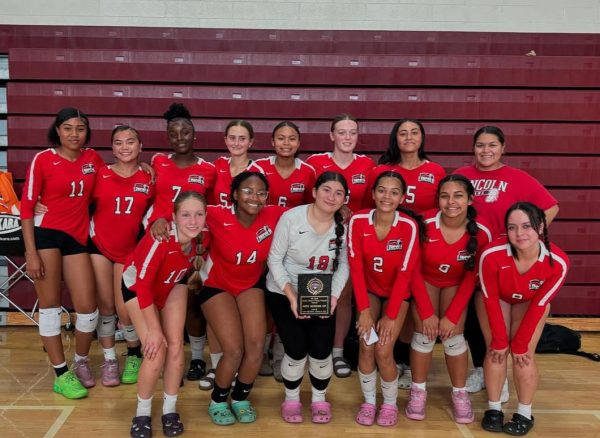 Junior Varsity Girls Volleyball with 2nd place trophy at Stockton Classic